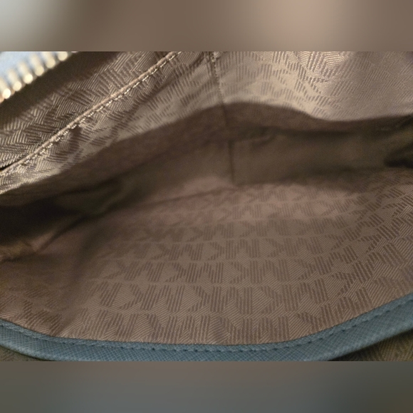 The Michael Kors Jet Set Travel Crossbody Bag in light blue - Picture 6 of 12